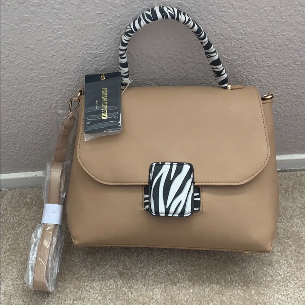 Tan with zebra print purse.